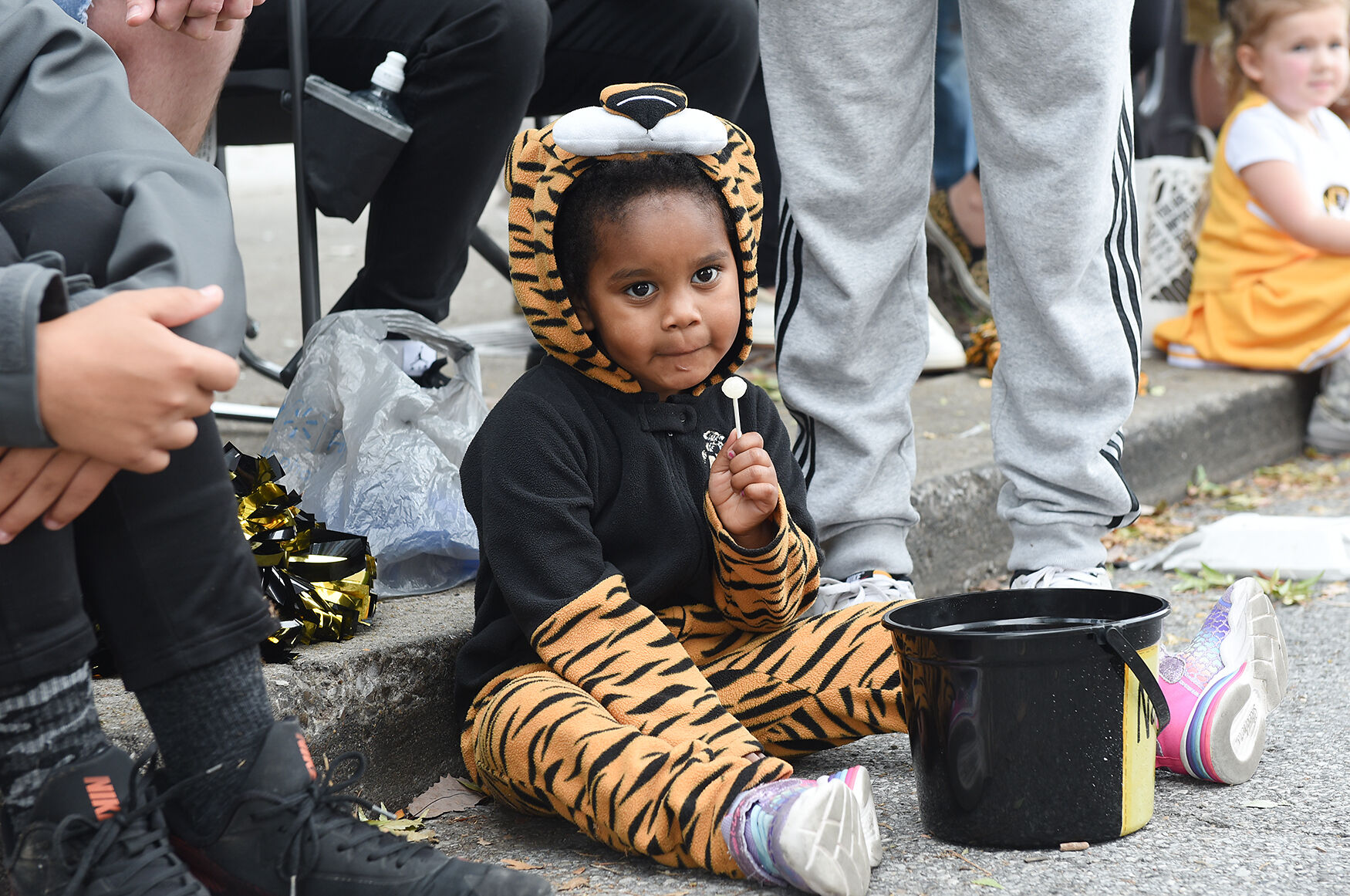 Naeema Aden, 3, watches the parade during the homecoming parade